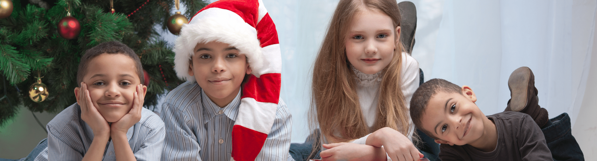 children near a Christmas tree