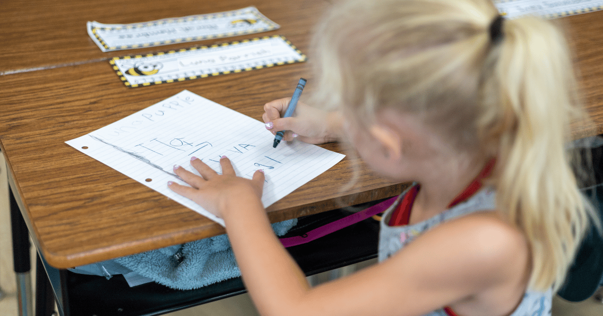 a Camp iRock student works on her writing