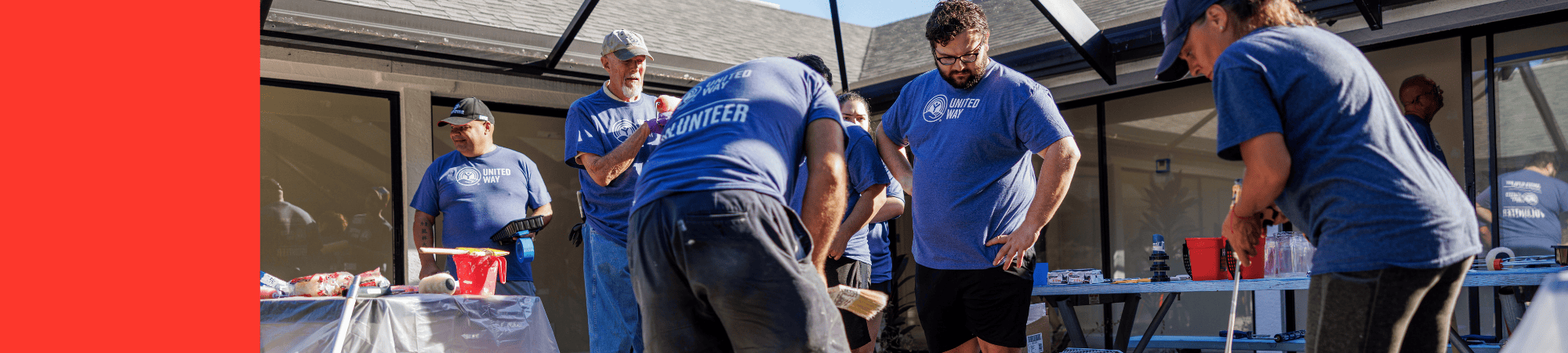Volunteers prepare to paint as part of long-term disaster recovery