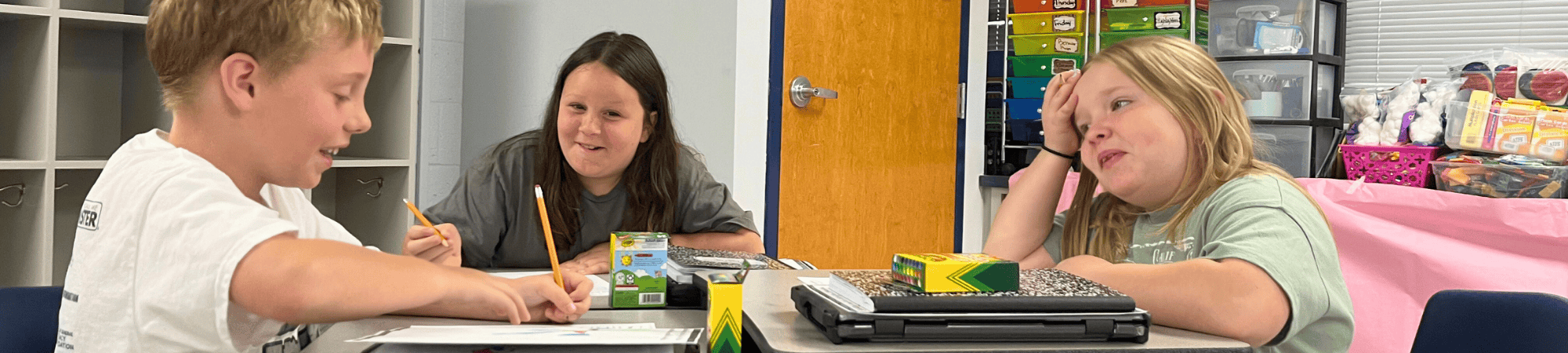 three camp irock students working at a table