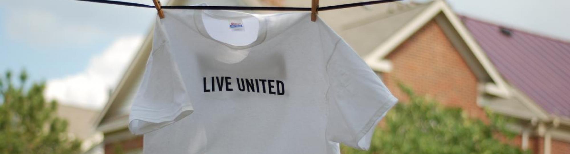 LIVE UNITED tshirt hanging on a clothes line.