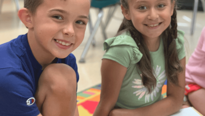 two Camp iRock campers smile at the camera