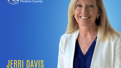 Jerri Davis, Director of Corporate Engagement, United Way of Pickens County with a posed photo of Jerri