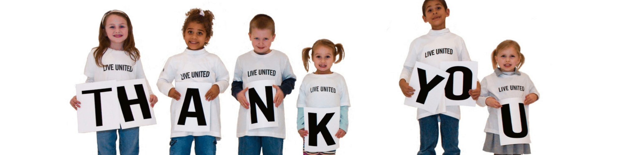 children wearing Live United tshirts holding Thank You sign